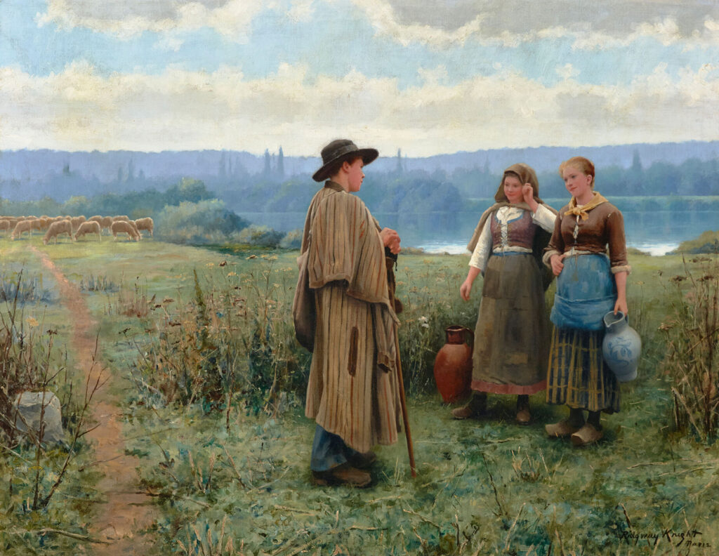 A man and two woman in a field