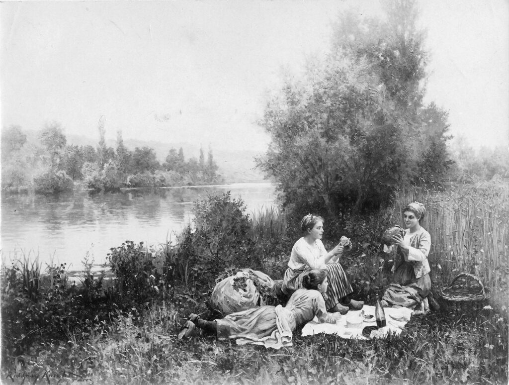 three women by the river eating