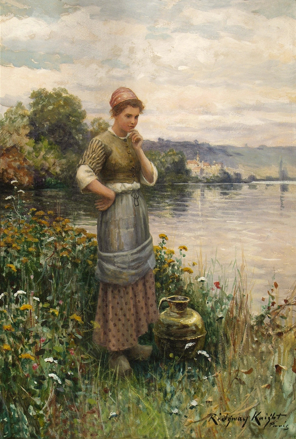 woman standing by a lake